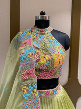 Load image into Gallery viewer, Pista Green Organza Lehenga With Zari, Sequins and Multi-Thread Work
