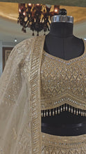 Load and play video in Gallery viewer, Golden Silk Lehenga with Sequins, Zari, Mirror and Beads Work
